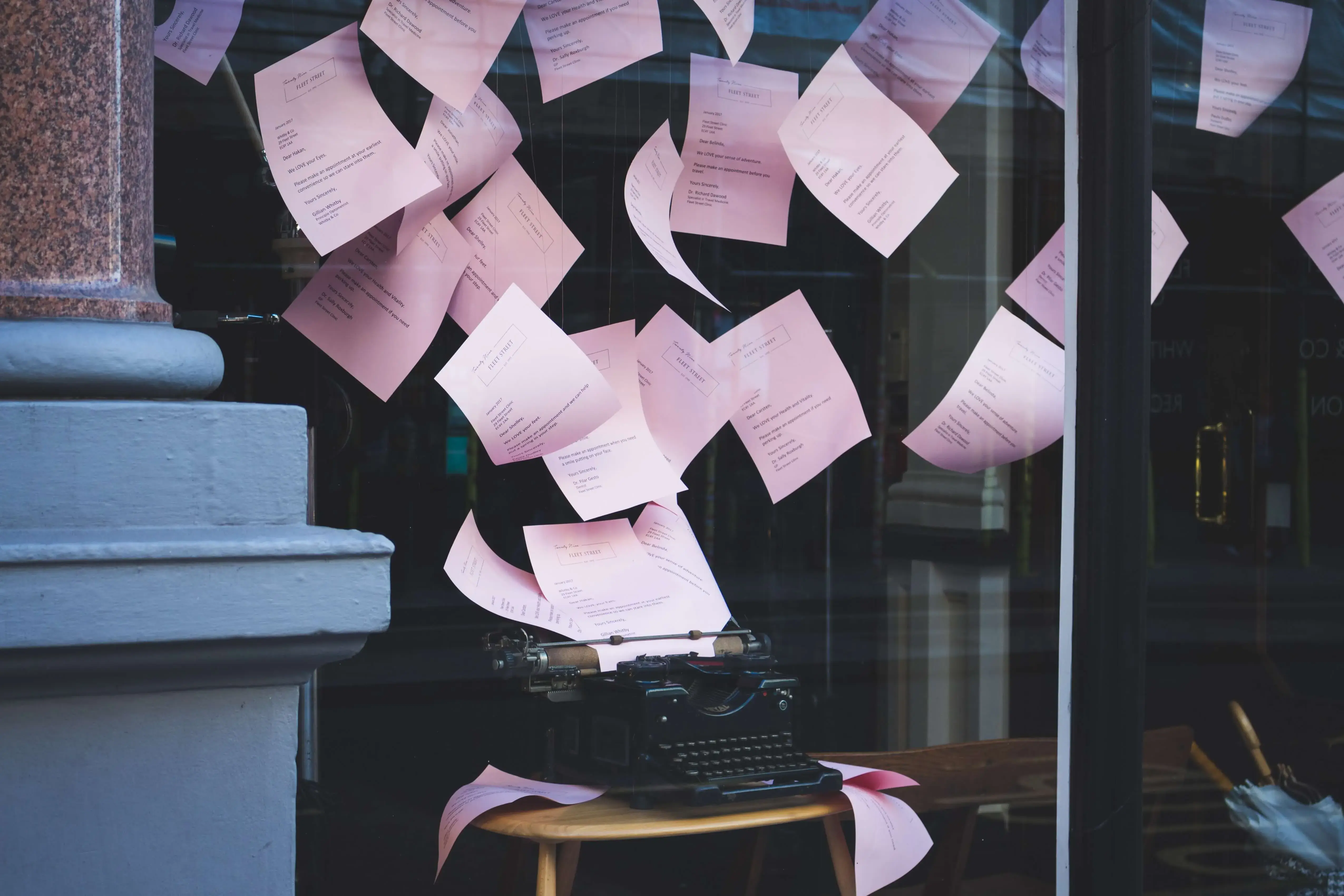 Old typewriter with papers flying out symbolizing outdated technology